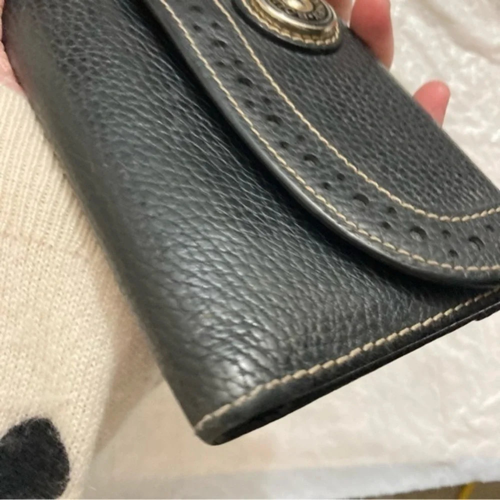 Dooney and Bourke rare perforated black pebbled leather 2 piece wallet set